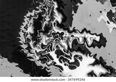 Abstract acrylic paint mix in black and white