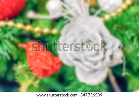 Defocused background of a Christmas Tree with red decorations. Intentionally blurred post production for bokeh effect