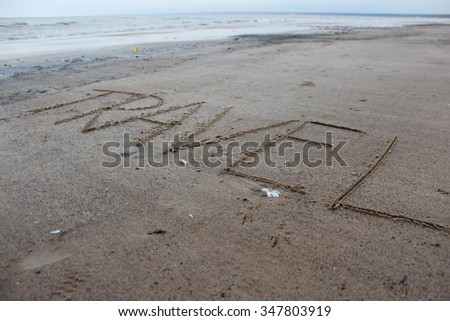Inscription on the sand "Travel".