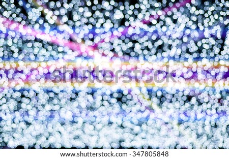 abstract background with bokeh lights and laser beam.
