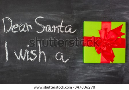 nostalgic home christmas decoration with antique toys. vintage arrangement and blackboard with sample text Dear Santa