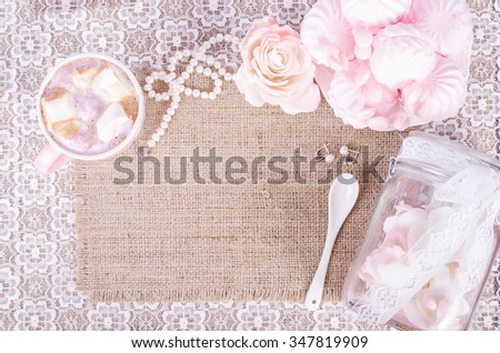 Cute set of pink princess accessories and sweets. Bottle with mastic flowers, big peach rose, zefir, cup of cacao with marshmellow, little spoon and pearl jewerly. 