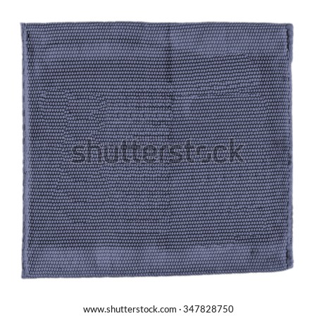 old and dirty gray-blue textile tag on whiite background