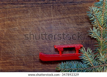 Christmas tree with Christmas decorations on wooden background