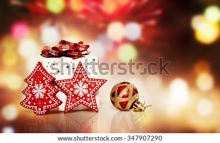 Christmas decoration and gift box on bokeh background