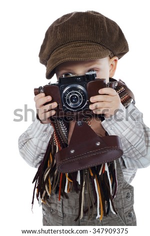 little funny boy with aged retro camera