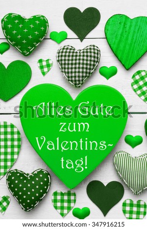 Texture With Many Green Fabric Hearts On White Wooden Background. Retro Or Vintage Style. German Text Alles Gute Zum Valentinstag Means Happy Valentines Day. Vertical Image