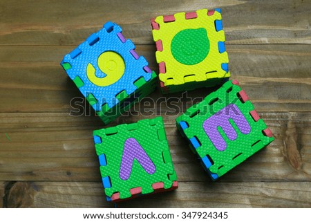 Block letters and numbers on wood background