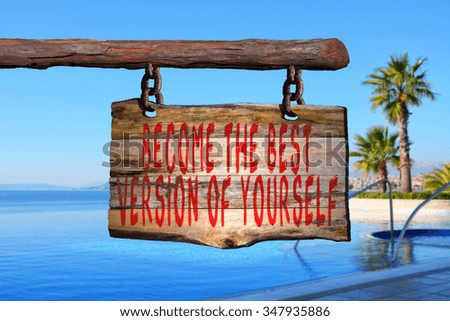 Become the best version of yourself motivational phrase sign on old wood with blurred background