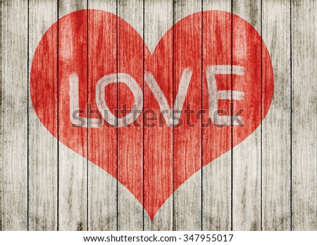 love symbol and word ''love'' on wooden floor