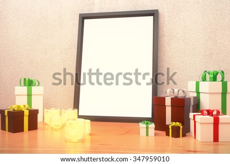 Blank picture frame  with gift boxes and glowing candlesticks on wooden floor, mock up