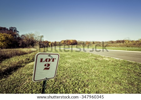 Lot for sale sign with vintage colors