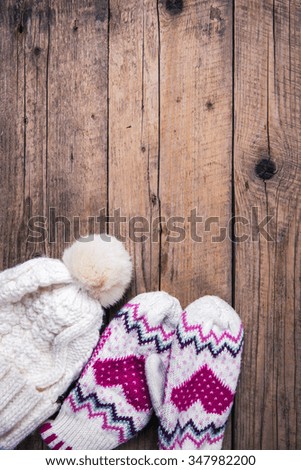 wooden background Classic gloves with cap