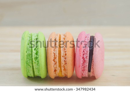 Colorful French Macarons On Wooden background