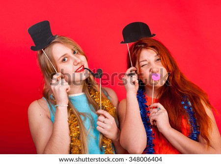 Young nice girls have fun on a party