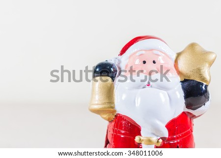 Santa Claus Holding Gold Star and Bell