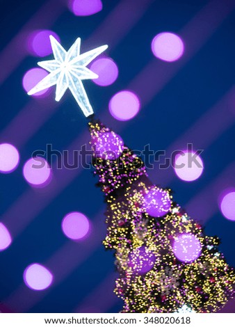 Abstract christmas tree silhouette with blurred lights