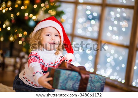 little girl gives a gift