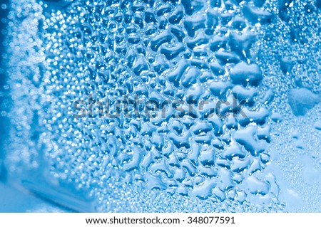 the fresh blue background of water drops