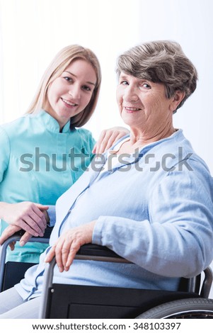 Photo of sick senior woman and cheerfulness carer