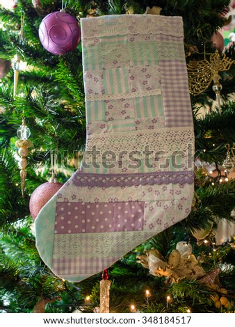 Christmas patchwork socks on a christmas tree