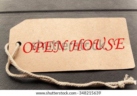 Open house in red text on a brown paper price label