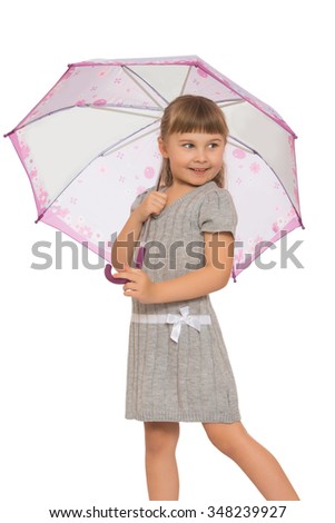 Charming , shy, beautiful little girl with flowing blonde hair and a short fringe , took refuge under the umbrella. The girl thoughtfully looks aside. -Isolated on white background