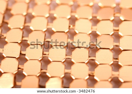golden glistening glitter of a plate of gold jewelry background