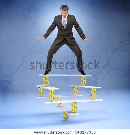 Businessman standing on balance with dollar sign and looking down