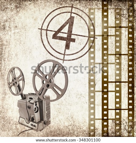 Textured old paper background with film strips and vintage reel movie projector for cinema. Vintage film stripe cinema abstract background. Cinema concept. Image done in retro style with sepia effect 