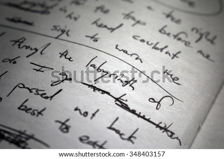 Lyrics scribbled on white paper. Focus on the word "labyrinth" in center. Royalty-Free Stock Photo #348403157