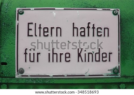 German sign that says Parents are responsible for their children which means: no trespassing the construction site