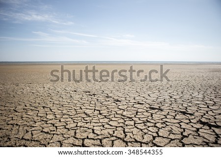 Dry cracked desert. The global shortage of water on the planet. Global warming and greenhouse effect concept. Royalty-Free Stock Photo #348544355