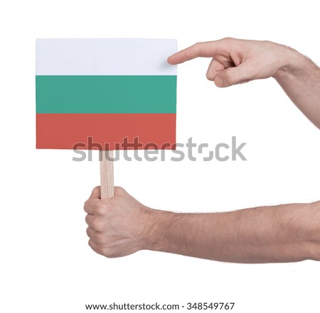 Hand holding small card, isolated on white - Flag of Bulgaria