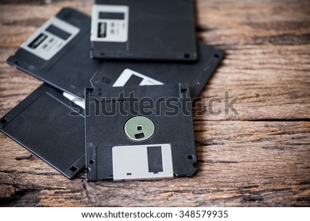  floppy disks on a wooden table