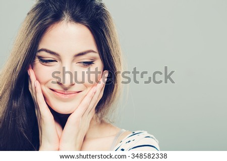 Beauty Woman face Portrait. Beautiful Spa model Girl with Perfect Fresh Clean Skin. Brunette female looking at camera and smiling. Youth and Skin Care Concept. Royalty-Free Stock Photo #348582338