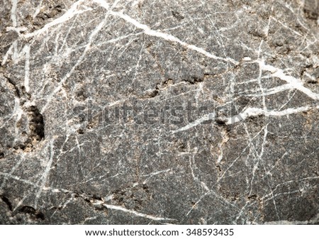 The surface of natural stone as a natural background. Selective focus. Shallow depth of field. Toned.