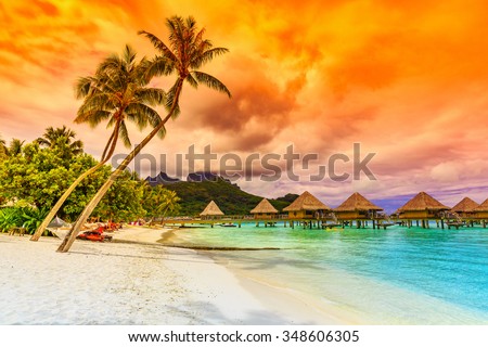 Bora Bora, French Polynesia. Otemanu mountain, beach and palm trees. Royalty-Free Stock Photo #348606305
