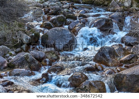 Beautiful bright contrasting mountain landscape. The mountain river flows fast through the mountain rocks, forming waterfalls and a lot of spray. Balkan Mountains, Bulgaria, Europe