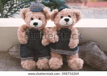 two teddy bear picnic love concept, couple teddy bears on wood background vintage style