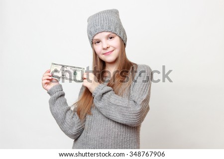 Fashion little girl with cash money dollars US