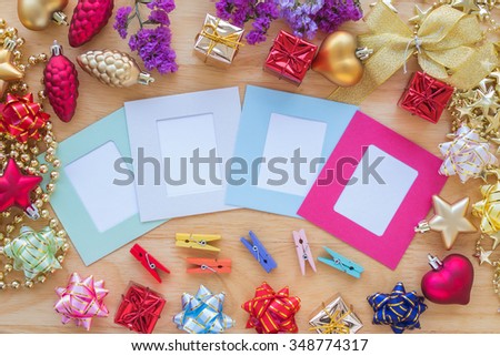 Happy New Year background decoration and paper photo frame over wooden table, Happy New Year concept