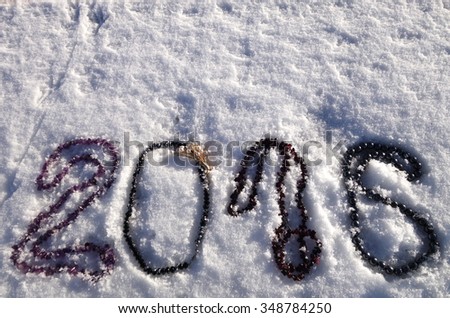  2016 numbers made of beads on snow background. Design for New Year conception.                              
