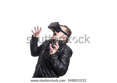 Handsome guy using VR glasses Royalty-Free Stock Photo #348801032