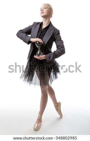 Dancer holding an hourglass with black sand on white background
