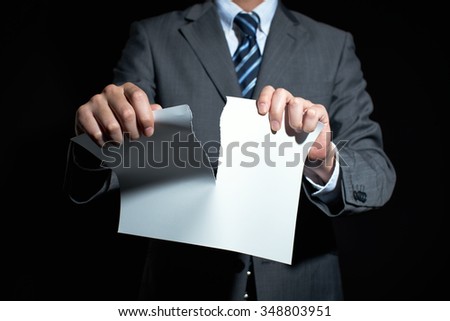Businessman tear paper concept for breaking contract