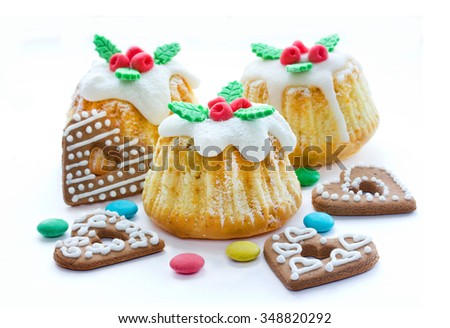 Christmas cakes with traditional decoration, candy and cookies in the form of hearts isolated on white background