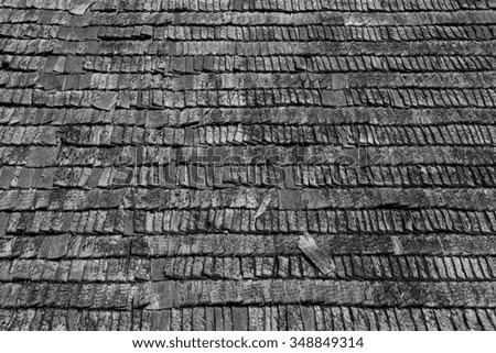 Wood shingles on an old roof - black and white photograph.