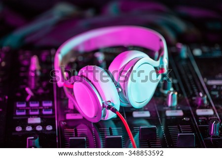 DJ sound equipment at nightclubs and music festivals, EDM, future house music and so on. Parties concept, sound technique. DJ playing on the best, famous CD players. Royalty-Free Stock Photo #348853592