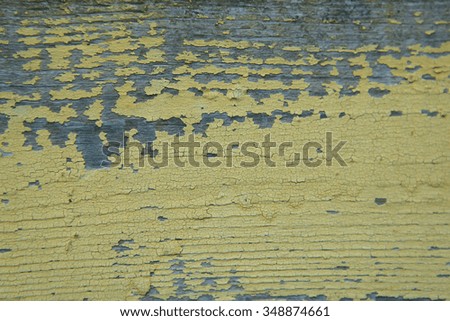 Old wooden plank texture with yellow dried paint